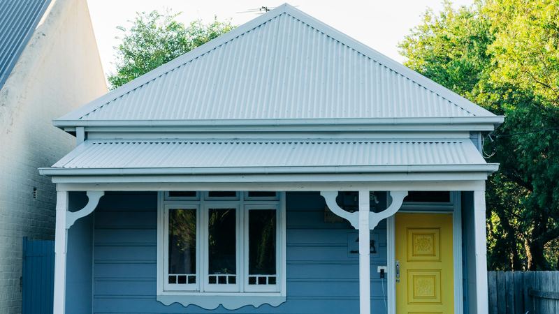 A weatherboard cottage with a front garden in New South Wales
