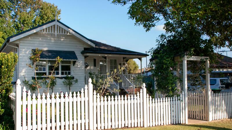 A family home behind a front fence in suburban New South Wales