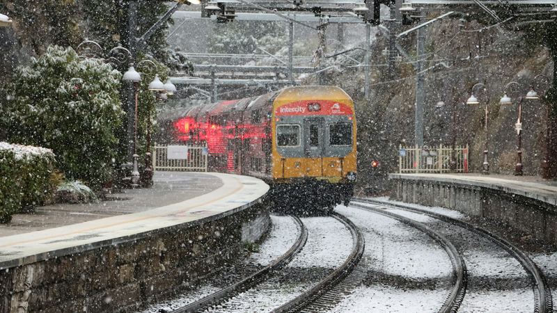Snow falling on the train line at Mount Victoria station